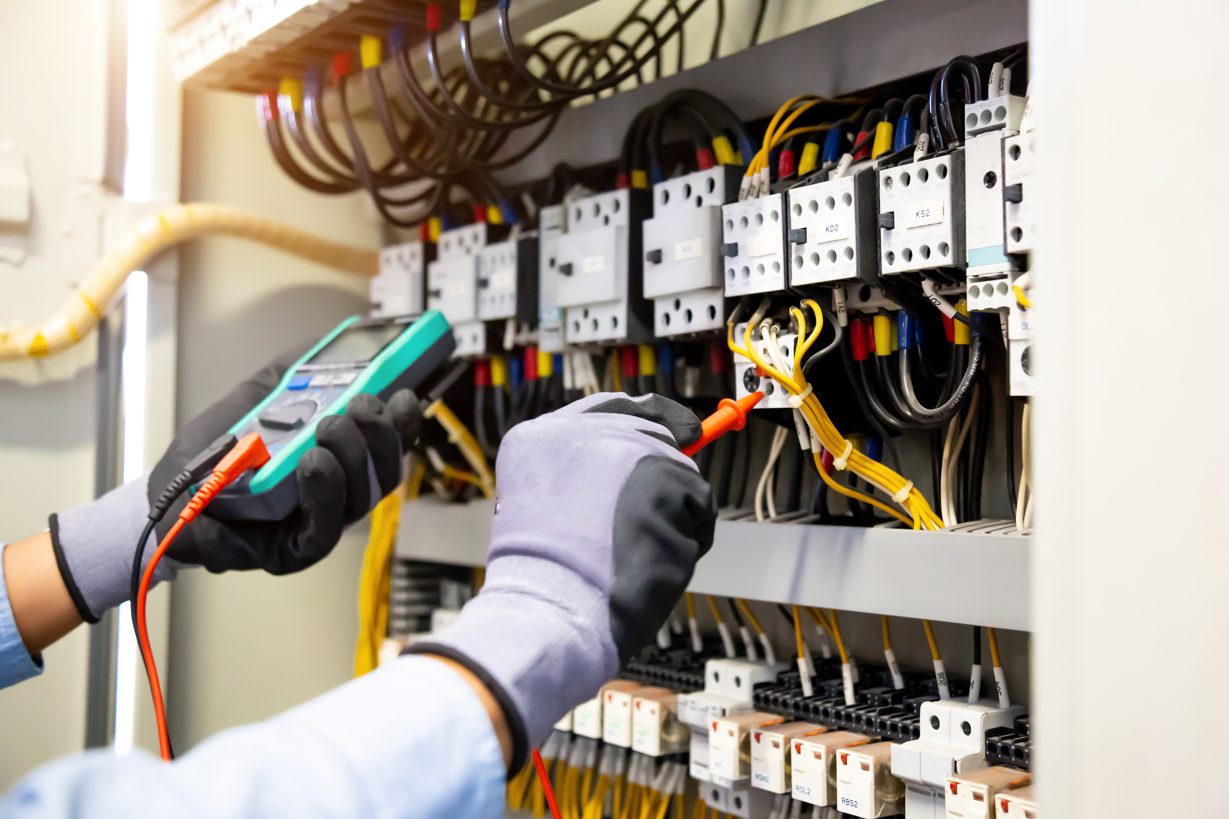 Engineer testing an ATS control panel for a bank